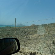 There was an awful lot of barbed wire lined desert, watch towers and small airports along the road. Or maybe we are just watching too many movies. Oh wait, then there was the story of an airplane full of illegal content crashing to the ocean near Los Barrilos. Anyway, we made a point of not stopping and engaging anyone in anything. Míle a míle ostatného drátu v poušti, občas strážní věž a letištní  balon ukazující směr větru. Těžko věřit, že někdo investoval aby ochránil kaktusy. Projížděli jsme tudy bez zastávky a bez výtržností. : Baja2011